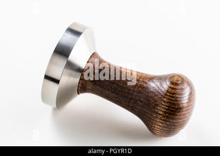 A coffee or espresso tamper that might be used by a barista in a coffee shop Stock Photo