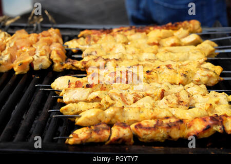 Kebabs cooking on grill at Persian Kebab on Paul Street in Shoreditch East London UK  KATHY DEWITT Stock Photo