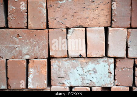 Neat pile of bricks waiting to be used at a building site in Vietnam Stock Photo