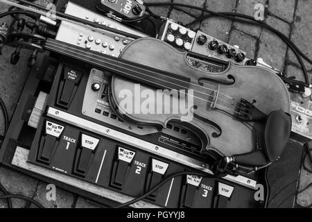 Beautiful violin on electronic mixing deck taken at a wedding on 25/08/2018 Stock Photo