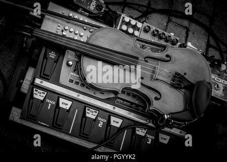 Beautiful violin on electronic mixing deck taken at a wedding on 25/08/2018 Stock Photo