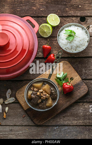 Massaman beef curry on wood background.coconut milk curry. Stock Photo