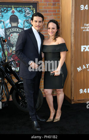 Hollywood, California, USA. 28th Aug, 2018. August 28, 2018 - Hollywood, California, U.S. - RICHARD CABRAL and wife JANIECE SARDUY pose upon arrival for the FX's MAYAN's M.C. Premiere at TLC Chinese Theatre. Credit: Alexander Seyum/ZUMA Wire/Alamy Live News Stock Photo