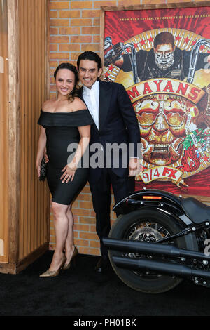 Hollywood, California, USA. 28th Aug, 2018. August 28, 2018 - Hollywood, California, U.S. - RICHARD CABRAL and wife JANIECE SARDUY pose upon arrival for the FX's MAYAN's M.C. Premiere at TLC Chinese Theatre. Credit: Alexander Seyum/ZUMA Wire/Alamy Live News Stock Photo