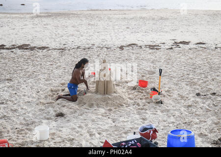 Adelaide Australia. 29 August 2018. A man builds a sandcastle in the coastal suburb of  Henley on a warm sunny afternoon. Adelaide is experiencing warmer temperatures  on the final stages of the Australian winter season and the onset of spring Credit: amer ghazzal/Alamy Live News Stock Photo