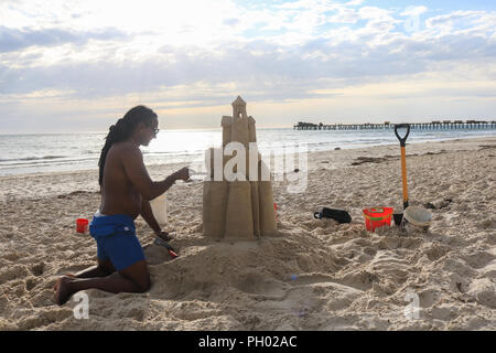 Adelaide Australia. 29 August 2018. A man builds a sandcastle in the coastal suburb of  Henley on a warm sunny afternoon. Adelaide is experiencing warmer temperatures  on the final stages of the Australian winter season and the onset of spring Credit: amer ghazzal/Alamy Live News Stock Photo