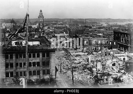 [ 1923 Japan - Great Kanto Earthquake in Tokyo ] —   Higashimachi-dori in Yokohama, Kanagawa Prefecture. The tower is the Yokohama Kaiko Kinenkan.  Devastation caused in Yokohama by the Great Kanto Earthquake (Kanto Daishinsai) of September 1, 1923 (Taisho 12). Some simple shelters have been erected by survivors. The quake, with an estimated magnitude between 7.9 and 8.4 on the Richter scale, devastated Tokyo, the port city of Yokohama, surrounding prefectures of Chiba, Kanagawa, and Shizuoka, and claimed over 140,000 victims.  20th century vintage gelatin silver print. Stock Photo