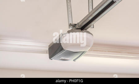 Automatic Garage Door Opener Motor on the Ceiling. Close Up Stock Photo