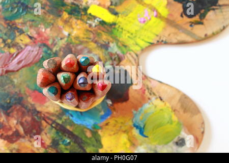 Tools for creativity, namely pencils, palette and brushes Stock Photo