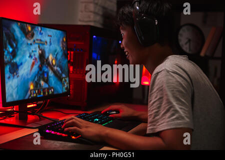 Premium Photo  Gamer playing online game on pc in dark room.