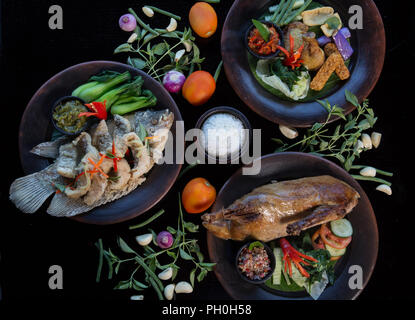 Many different various dishes top view. Fish, duck, chiken on dark background Stock Photo