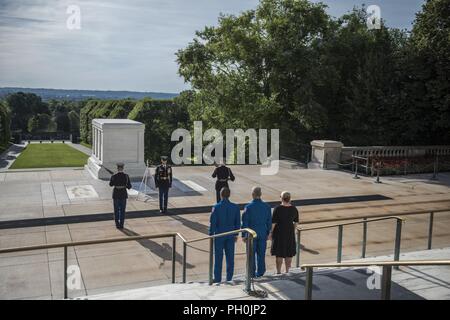 NASA astronauts Joe Acaba (left) and  Mark Vande Hei (center) watch the Changing of the Guard Ceremony at the Tomb of the Unknown Soldier at Arlington National Cemetery, Arlington, Virginia, June 15, 2018. While at ANC, Vande Hei and Acaba presented to Col. Jerry Farnsworth, chief of staff, Arlington National Cemetery and Army National Military Cemeteries, an ANC Employee Patch that was flown aboard the International Space Station (ISS) during Expeditions 53/54. They also presented Col. Jason Garkey, regimental commander, 3d U.S. Infantry Regiment (The Old Guard), with a Tomb Guard Identificat Stock Photo
