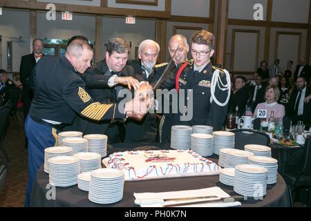 From left, Command Sgt. Major Rodger Mansker, Army Materiel Command command sergeant major; retired Chief Warrant Officer 5 Dr. Harry Hobbs; retired Army Col. Sam Torrey; Dr. Joe Fitzgerald, Civilian Aide to the Secretary of the U.S. Army; Gen. Gus Perna, Army Materiel Command commanding general and cadet Bailey, from the New Century High School Junior Reserve Officers' Training Corps, cut the cake during the Army Birthday Ball hosted by the Association of the U.S. Army in Huntsville, Alabama, June 15, 2018. The U.S. Army celebrates its 243rd Birthday. Stock Photo