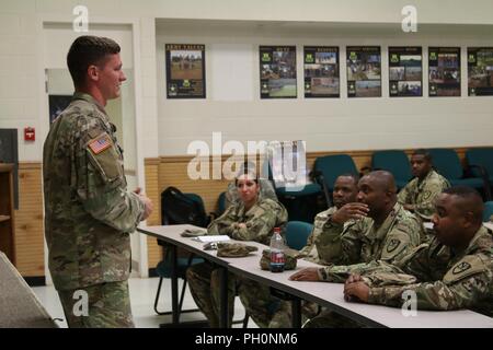 Staff Sgt. Seth Drumm, 5-19th Military Police Battalion, instructs members of the Virgin Islands National Guard 661st Military Police Law and Order Detachment on the Evasive Vehicle Operators Course as part of their annual training at Ft. Polk, LA, June 18, 2018. This annual training reiterated and put to use the members of the 661st Military Police Law and Order Detachment military occupational specialty. Stock Photo