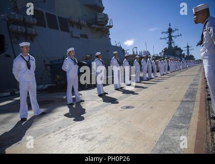 PEARL HARBOR (June 19, 2018) Hawaii-area Sailors render honors to retired Chief Boatswain's Mate and Pearl Harbor survivor Ray Emory during a farewell ceremony held before he departs Hawaii to be with family. Emory was responsible for the identification of unknown service members killed in the attacks on Pearl Harbor who were buried in unnamed graves. Stock Photo