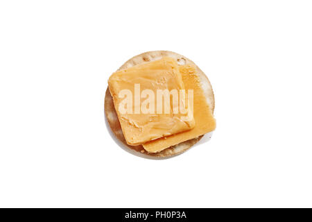 Isolated cheddar cheese slices and water cracker over a white background. Clipping path included. Stock Photo