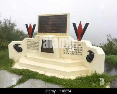 IWO TO, Japan (June 14, 2018) – In a limited four-hour tour, Sailors and Marines visit the historic island of Iwo To, Japan, formerly known as Iwo Jima, exploring caves, walking the famous black sand beaches and climbing Mount Suribachi. Stock Photo