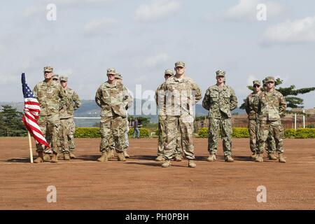 U.S. Army Soldiers stand in formation at the opening ceremony for Justified Accord 2018 at the Ugandan Rapid Deployment Capability Center, Jinja, Uganda, June 18, 2018. Justified Accord is a two-week combined and joint exercise designed to demonstrate the capacity and capability of participants in peacekeeping operations and employing  African Union Mission in Somalia procedures. Stock Photo