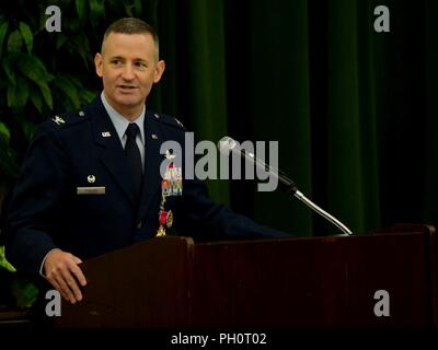 Col. Bradley Pyburn, 67th Cyberspace Wing commander, listens to Maj ...