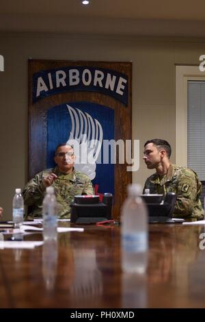 VICENZA, Italy -- United States European Command (EUCOM) Commander Gen. Curtis Scaparrotti (left) shares a story of airborne relevance with Maj. David Ahern, Executive Officer for the 173rd Airborne Brigade, on June 22, 2018. The 173rd Airborne Brigade is the U.S. Army’s Contingency Response Force in Europe, providing rapidly deploying forces to the U.S. Army Europe, Africa and Central Command Areas of Responsibility within 18 hours. Stock Photo