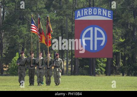 The U.S. Army 82nd Airborne Division Artillery, 82nd Airborne Division, color guard awaits inspection by their new commander, Col. Joe Hilbert, during a change of command ceremony on Fort Bragg, North Carolina, June 22, 2018. The ceremony marked the transfer of authority for the Army’s largest airborne artillery organization. Stock Photo