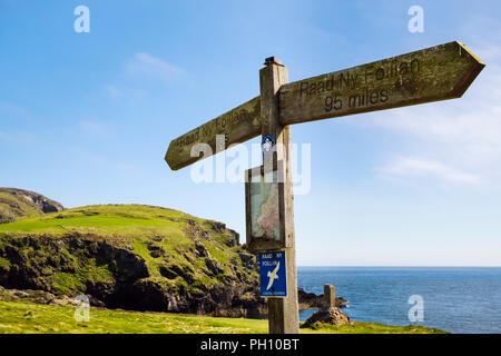 Raad Ny Foillan Coastal Path direction signpost with map on southern coast. Kitterland, Isle of Man, British Isles, Europe Stock Photo