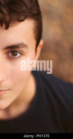 Half portrait of teenager guy looking at camera Stock Photo