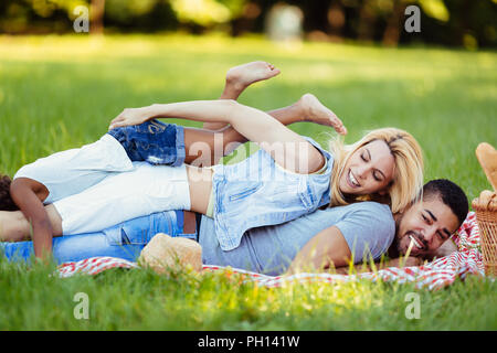 Happy family having fun time on picnic Stock Photo