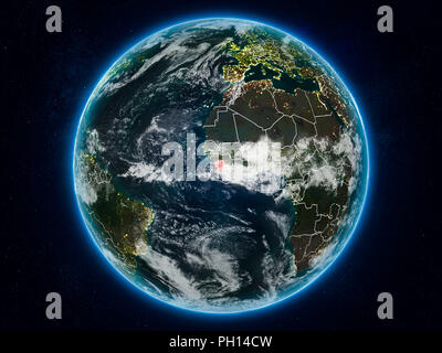 Sierra Leone from space on planet Earth at night with visible country borders. 3D illustration. Elements of this image furnished by NASA. Stock Photo