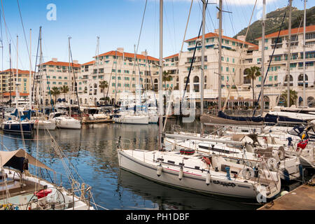 Gibraltar, Queensway Quay Marina, sailing yachts moored below waterfront buildings Stock Photo