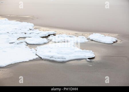 Freezing of fresh water in sea bay, close up view Stock Photo