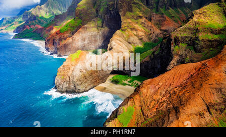 Honopu Arch and Honopu Beach on the Na Pali Coast (aerial), Napali Coast Wilderness State Park, Kauai, Hawaii USA Stock Photo