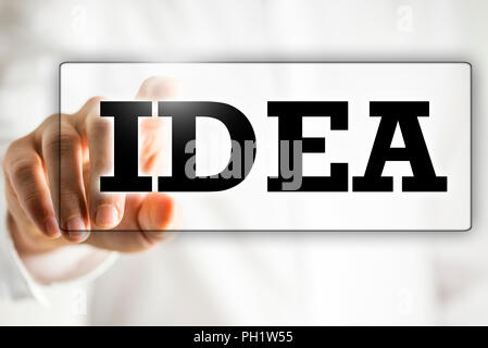 The word Idea on a virtual interface in a navigation bar with a businessman touching it with his finger from behind Stock Photo