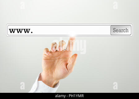 Businessman pushing a search bar on a virtual computer screen. Empty space ready for your web address or keywords. Stock Photo