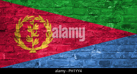 Flag of Eritrea over an old brick wall background, surface Stock Photo