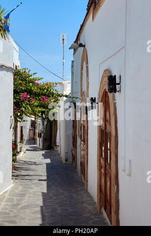 Typical street in the village of Lindos, Rhodes, Greece Stock Photo - Alamy