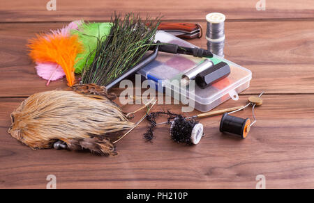 Various materials for knitting insects. Feathers, fur, thread. Stock Photo