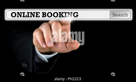Online booking written in a navigation bar on a virtual interface or computer screen with a businessman reaching out his finger to activate the button Stock Photo