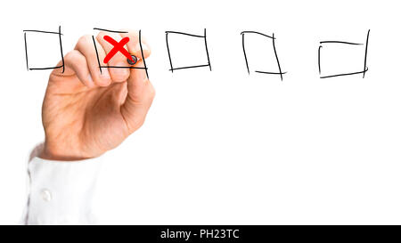 Man placing a red cross in a set of hand-drawn check boxes on a virtual interface over a white background with copyspace, close up view of his hand. Stock Photo