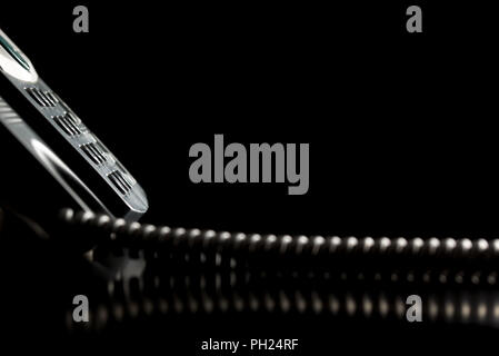 Dial-up buttons on the keypad of a landline telephone instrument over black background. Conceptual of customer service or customer support. Stock Photo