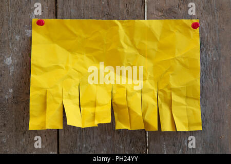 Blank yellow paper with tear off tabs Stock Photo