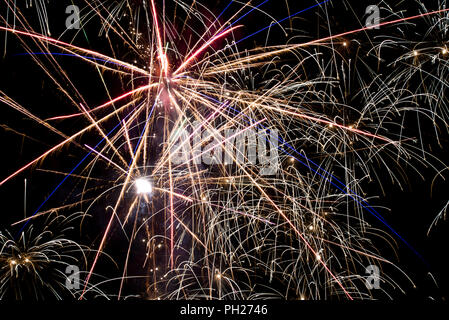 Detail of colorful fireworks in the night sky. Stock Photo