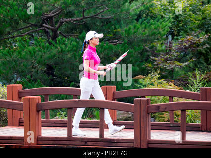 Jeongseon, east of Seoul, South Korea. 25th Aug, 2018. Shin-Ae Ahn (KOR) Golf : Shin-Ae Ahn of South Korea walks on the 16th fairway during the second round of KLPGA High1 Resort Ladies Open 2018 at the High1 Country Club in Jeongseon, east of Seoul, South Korea . Credit: Lee Jae-Won/AFLO/Alamy Live News Stock Photo