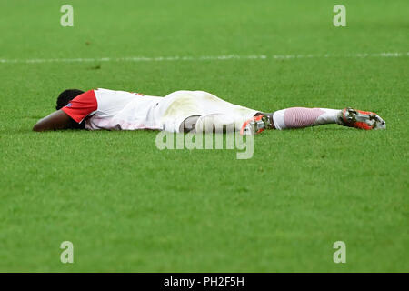 Salzburg, Austria August 29, 2018: CL - Quali - 18/19 - RB Salzburg Vs. Red Star Belgrade Reinhold Yabo (FC Salzburg), lies on ground, action/single image/cut out/dissatisfied/disappointed/disappointed/dejected/frustratedriert/| usage worldwide Stock Photo