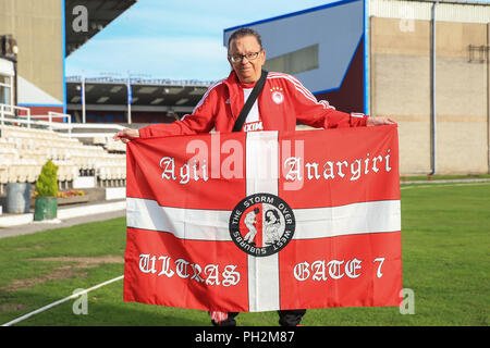 Burnley, UK. 30th August 2018, Turf Moor, Burnley, England; UEFA Europa League Play-off second leg Burnley v Olympiakos ; Olympiakos fan with their flag Credit: News Images /Alamy Live News Stock Photo