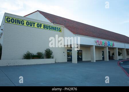Facade of Toys R Us store in Dublin, California with sign reading Going Out of Business following the toy retailer's bankruptcy, July 23, 2018. () Stock Photo