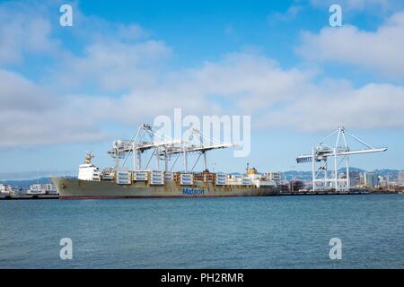 Container ship from the Matson Line loading intermodal freight containers via a gantry crane at the Port of Oakland, Oakland, California, August 13, 2018. () Stock Photo