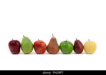 An assortment of apples and pears isolated on a white background all lined up Stock Photo