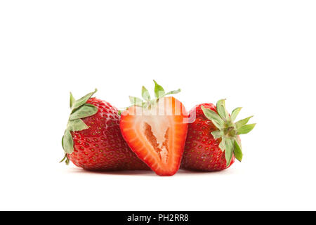 Strawberries isolated on a white background with one cut in half Stock Photo