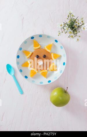 Pancakes with fruit for the children. Top view Stock Photo